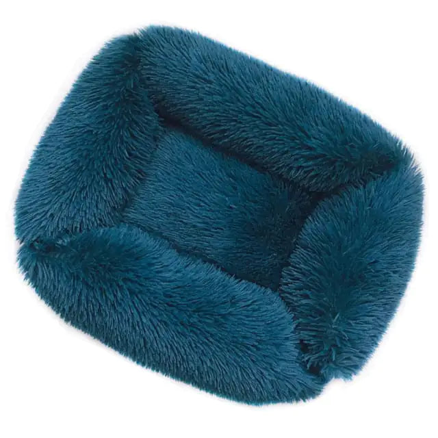 Comfortable and stylish Plush Pet Bed in soft teal color, ideal for pets to relax and sleep.